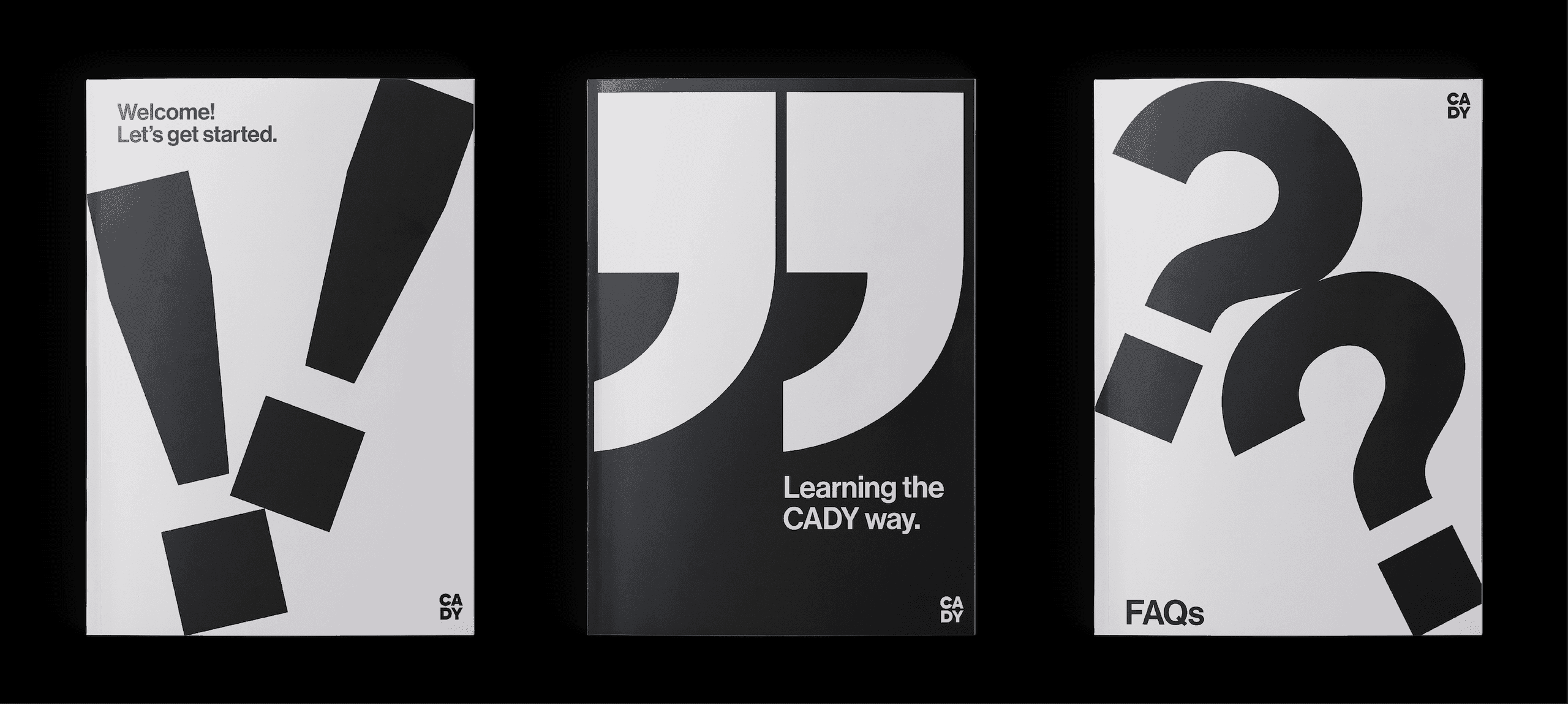 Orientation Guides. A set of black-and-white booklets using oversized punctuation to introduce CADY onboarding content.