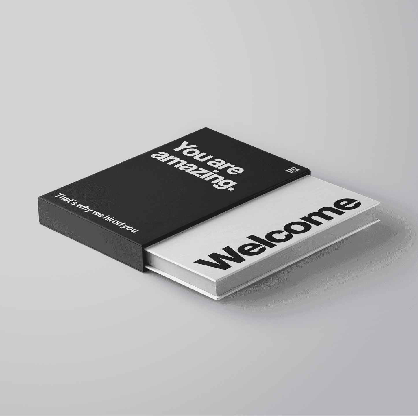 Welcome Kit. A premium welcome box and booklet using bold typography and a clean black-and-white palette.