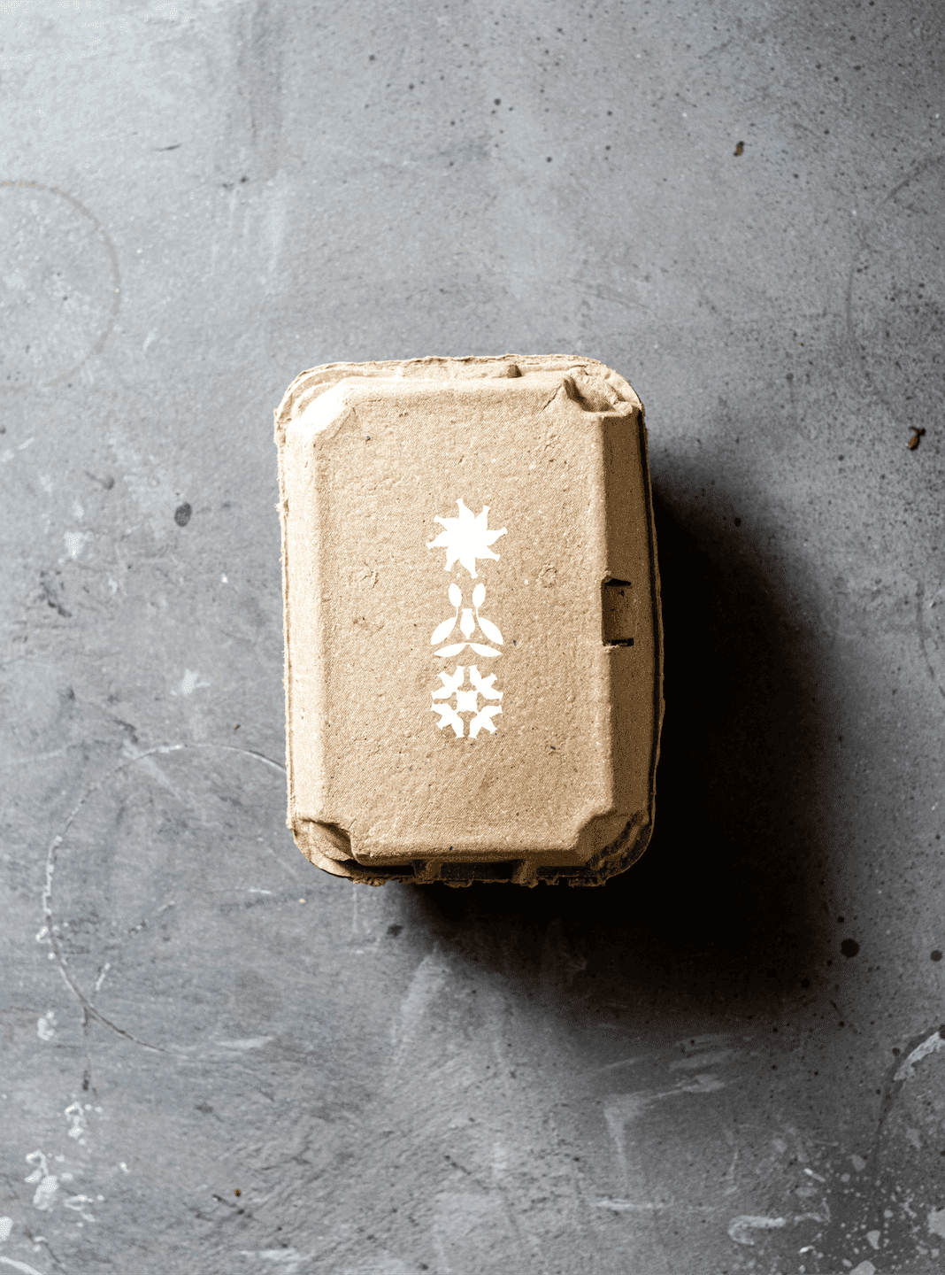Doghobble Wine Farm Produce Box. A kraft produce box stamped with the Doghobble Wine Farm floral mark for a rustic, farm-grown feel.